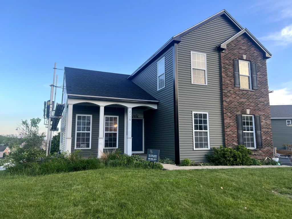 New siding, soffit, fascia, and gutters installed by Royalty Restorations on a Chicagoland home